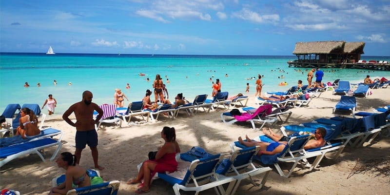 Tourists crowd the beach in Punta Cana