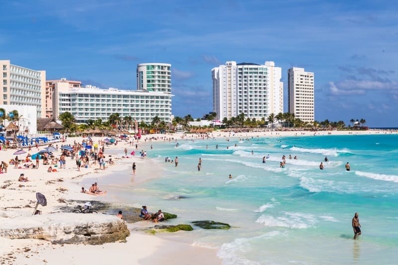 Tourists enjoying the beach in Cancun